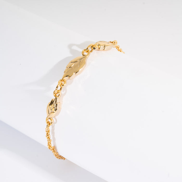 Bracciale con foglie in metallo color oro
